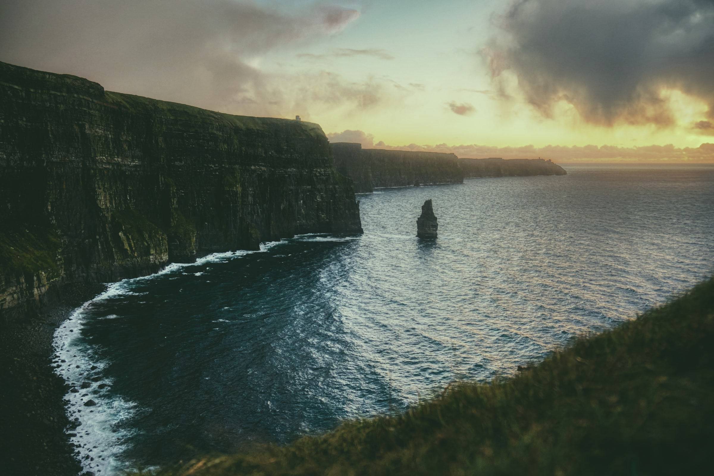 The Cliffs of Moher at sunset above the Atlantic